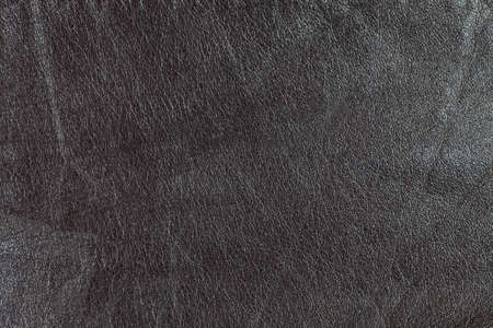 Dark brown real leather surface.の写真素材