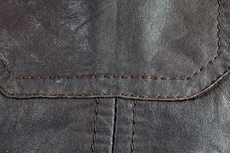 Dark brown real leather surface.の写真素材