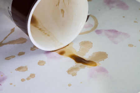 Coffee stains on a white tablecloth.の写真素材
