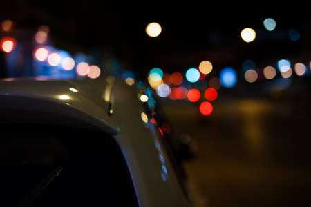 Colorful background blurred bokeh texture and defocused sparkling lights.の写真素材