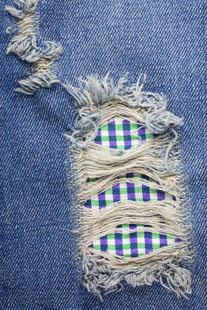 Textures ripped jeans.の写真素材