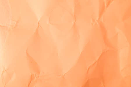 Texture creased orange paper background.の写真素材