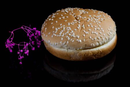 Burger bread texture on black background.の写真素材