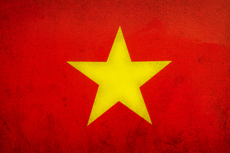 Flag of The Socialist Republic of Vietnam on old wall texture background.の写真素材