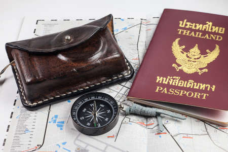 Compass, camera, passport,  on map for tourists.