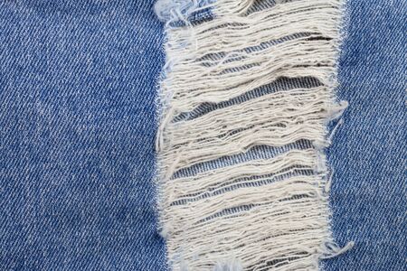 Old blue jeans background.