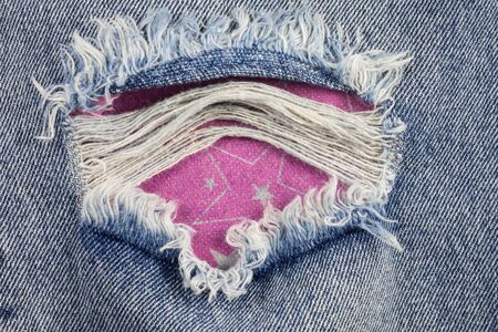 Jeans background, old jeans torn denim.の写真素材