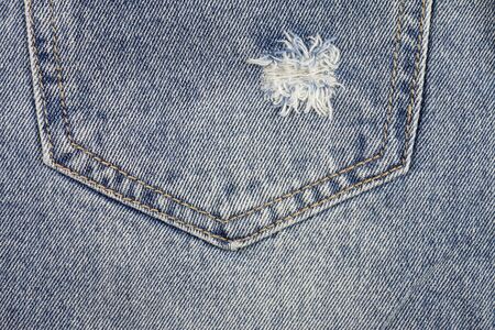 Jeans background, old jeans torn denim.