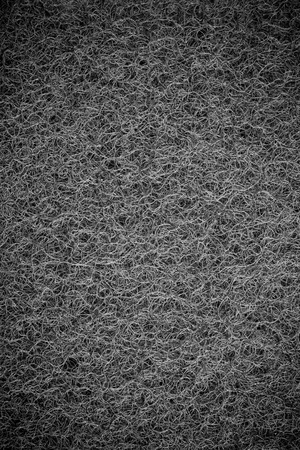 Black sponge cloth for dish washing, Scouring pad background.