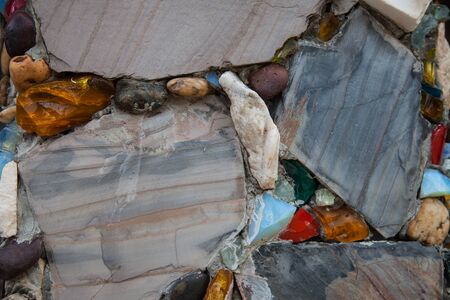 Recycled wall tiles stone, mosaic, broken glass, gravel, decoratively recycling reused.