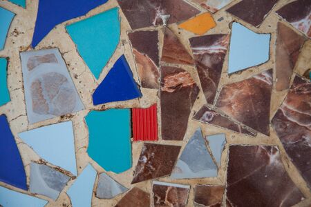 Recycled wall tiles stone, mosaic, broken glass, gravel, decoratively recycling reused.の写真素材