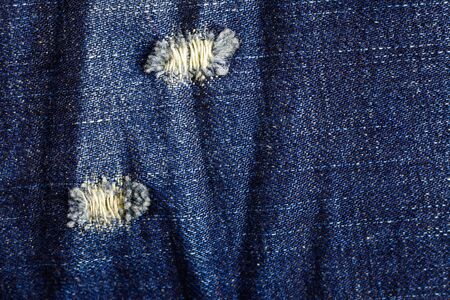 Denim old torn texture, Jeans background.