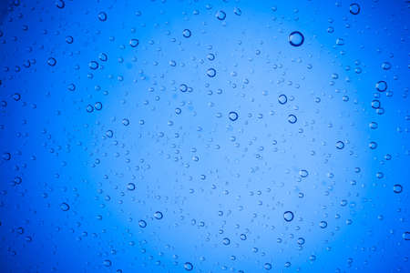 Water droplets on blue glass for a background, Drops of waterの写真素材