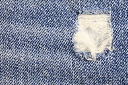 Jeans torn denim texture.