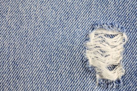 Jeans torn denim texture.