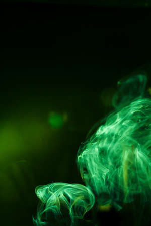 Green smoke movement on black background.の写真素材