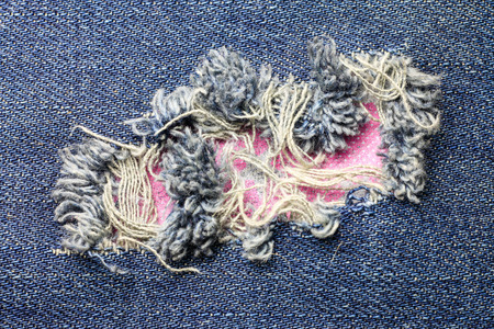 Jeans torn denim texture.
