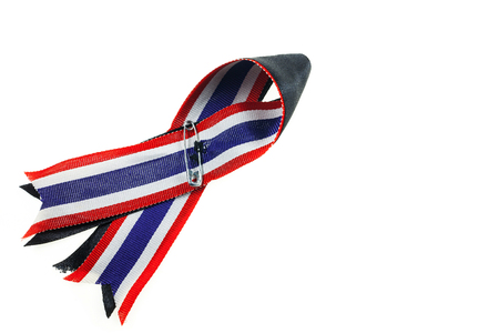 Thailand sadness,The symbol of mourning, Black ribbon and Thailand flag  ribbon.の写真素材