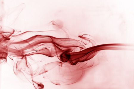 Red smoke movement on a white background.の写真素材