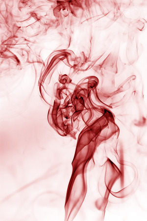 Red smoke movement on a white background.の写真素材