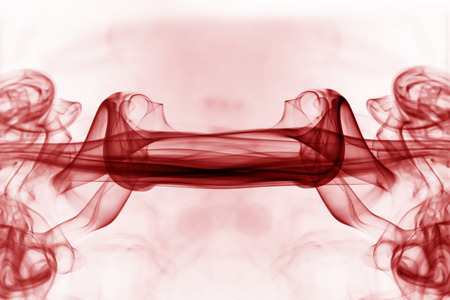 Red smoke movement on a white background.の写真素材