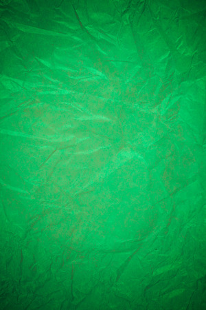 Crumpled green paper recycling background.の写真素材