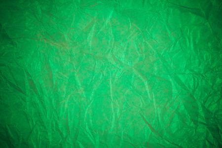 Crumpled green paper recycling background.の写真素材