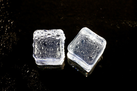 ice cubes on black background.の写真素材