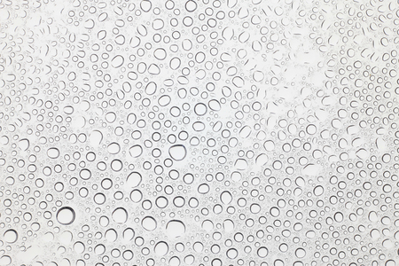 Water drops on glass, Rain droplets on glass background.の写真素材