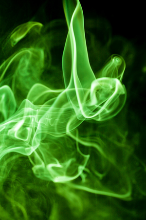 Green smoke movement on black background.の写真素材