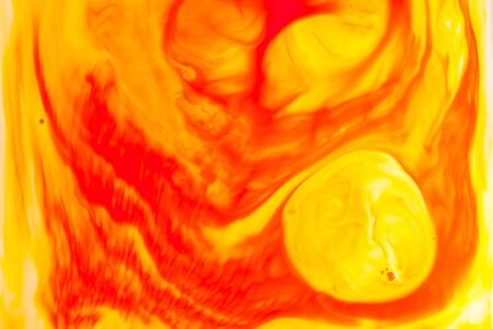 Orange oil paint on water abstract background.