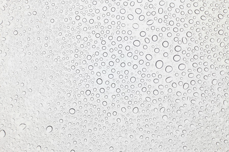 Water drops on glass, Rain droplets on glass background.の写真素材