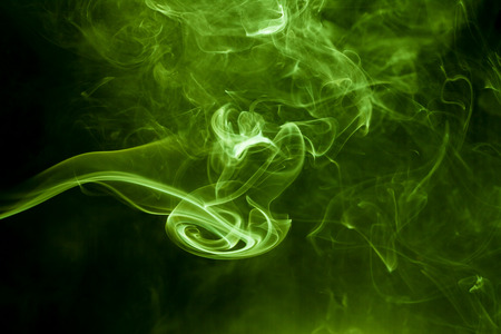 Green smoke on a black background. smoke on a black background.の写真素材