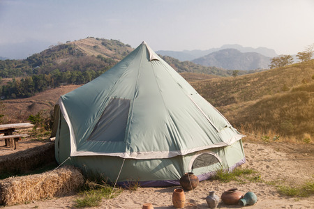 Camping on the him with sky and cloud.