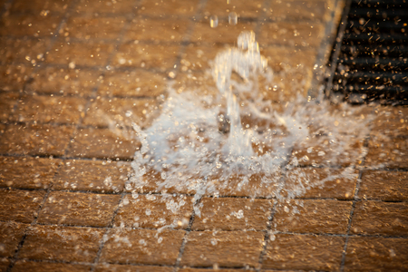 Splashes of water and bokeh of Water on a Sunset Background.の写真素材