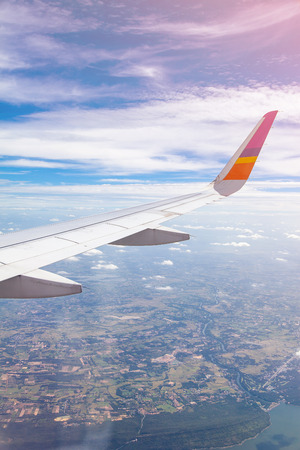 Aircraft Wing on blue sky and white clouds background.の写真素材