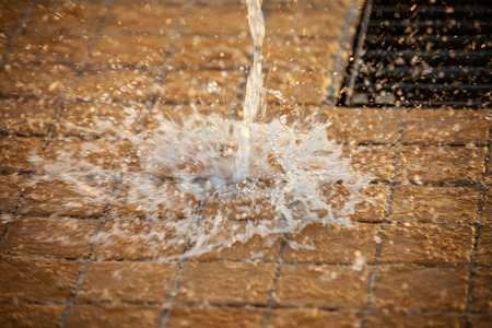 Splashes of water and bokeh of Water on a Sunset Background.の写真素材