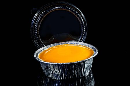 Orange cake on a black background.の写真素材
