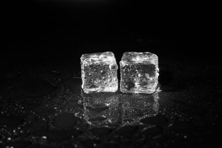 ice cubes on black table background.の写真素材