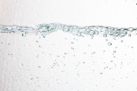 Closeup bubbles underwater on white background.の写真素材
