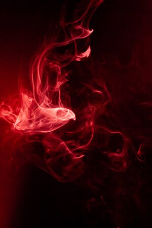 Red smoke motion on black background.の写真素材