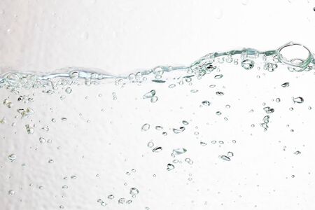 Closeup bubbles underwater on white background.の写真素材