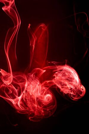 Red smoke motion on black background.の写真素材