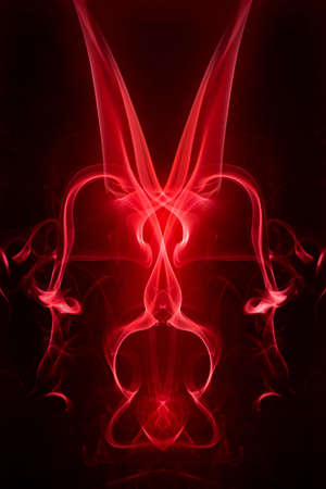 Red smoke motion on black background.