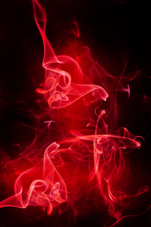 Red smoke motion on black background.の写真素材