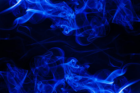 Blue smoke motion on black background.の写真素材