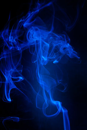 Blue smoke motion on black background.の写真素材