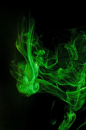 Green smoke motion on black background.の写真素材
