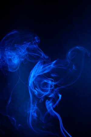 Blue smoke motion on black background.の写真素材