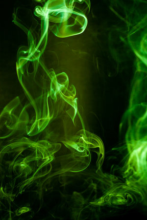 Green smoke motion on black background.の写真素材